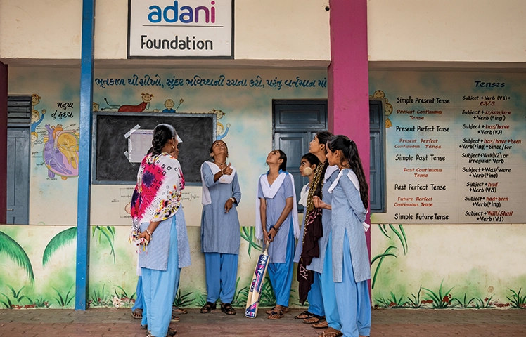Adani Foundation school girls with cricket bat