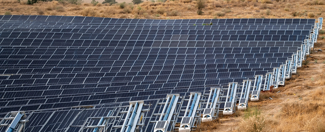 Waterless robotic cleaning of solar panels
