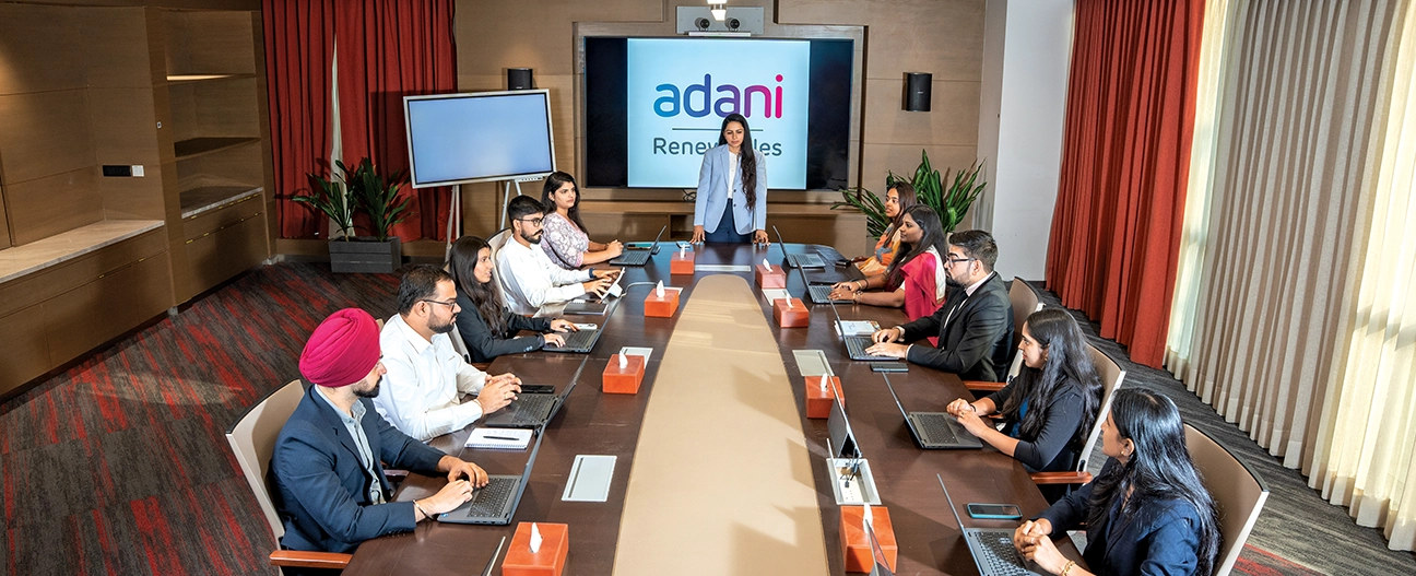 AGEL leadership/team in a boardroom (Adani Renewables)